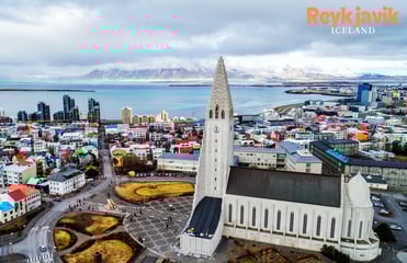 a tall tower with a clock tower in the middle of a city