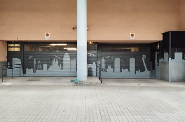 pintura mural graffiti parking garaje bloque edificio entrada vecinos comunidad propietarios