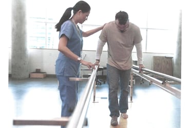 a physical therapist and a patient in a home