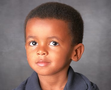 Headshot photo of handsome 2 year-old boy