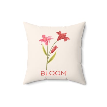 a pillow with a flower blooming on it