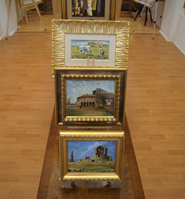 a display of paintings and paintings on display