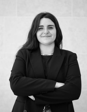 a woman in a black suit and a black and white photo