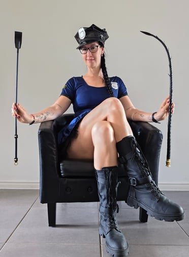 Pleasurelit Patricia dressed as a police officer with kinky tools