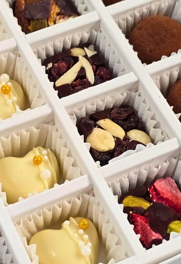 Gourmet Artisanal Assorted Chocolates including dark, milk, white chocolate, and truffles from Chocos Cookies Cakes