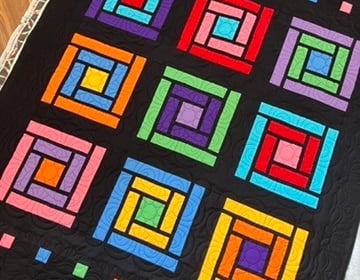 Colorful cabin windows quilt
