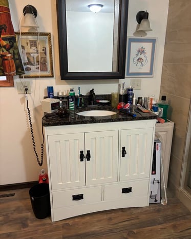 This bathroom remodel added a new sink with storage space in Goshen, IN.