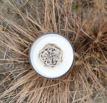 a glass of milk with a flower in the middle