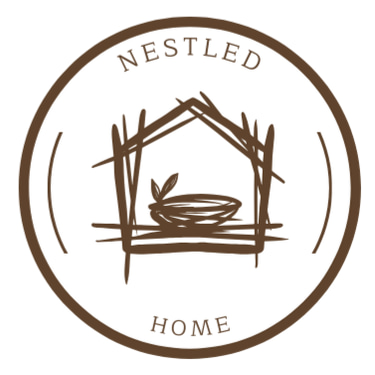Nestled at Home logo