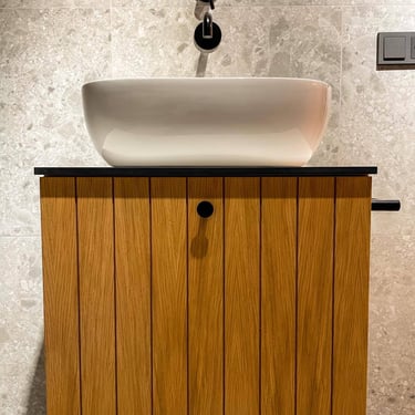 Custom bathroom furniture in natural oak bringing warmth, balance, and harmony to the space