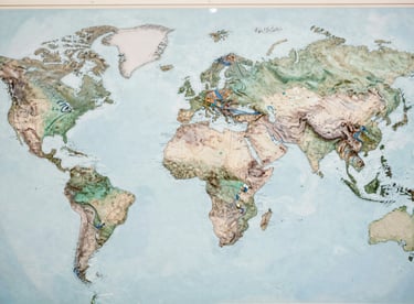 Details of a world map with interconnected shipping routes in muted teal and soft blue lines.