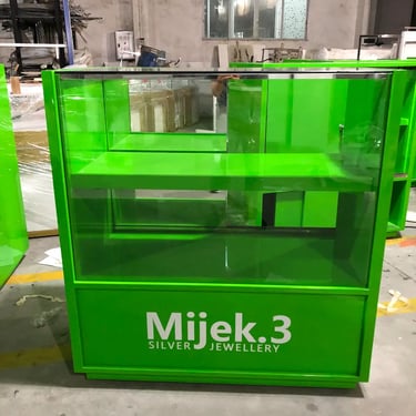 Custom lime green glass jewelry display case with internal shelf for Mijek.3 Silver Jewellery retail store.