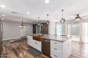 Modern kitchen remodel with white shaker cabinets and quartz countertops in Greensboro NC