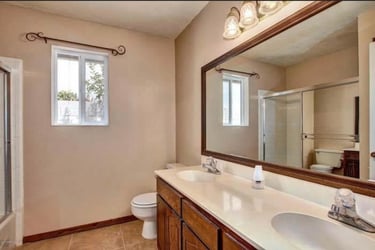 Before and after bathroom remodeling project with tile floors ahaker cabinets and quartz countertops near me