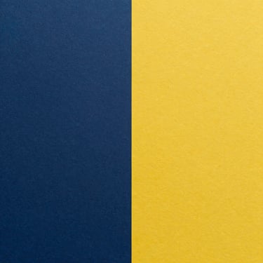 A minimalist split background featuring dark navy blue and vibrant yellow textured paper.