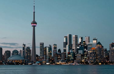 The exterior skyline of Toronto at night, emphasizing the urban service area, professional and high-end feel with #1E2B3A and #3A607C sky tones.