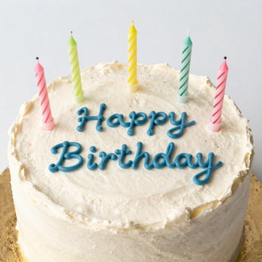 A birthday cake sitting on top of a wooden table