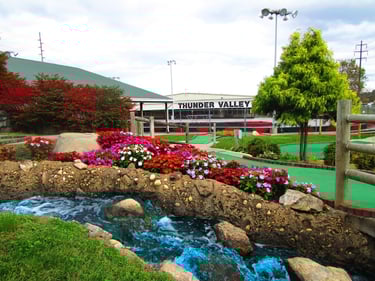 mini golf course with Thunder Valley sign in background 