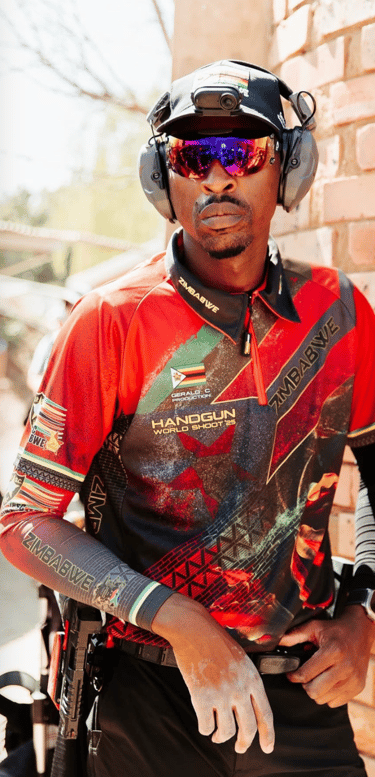 Gerald Chari at Handgun World Shoot wearing tactical gear and protective eyewear.