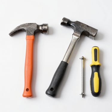 Elegant golden key resting on a navy blue velvet cushion symbolizing premium property access