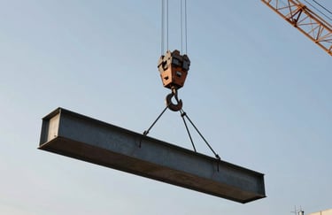 A close-up shot of a construction crane hook lifting a large steel beam into place against a clear morning sky. Symbolizes progress and reliability. Strong, authoritative composition. Incorporates #5C7D99 and #A68A6B.