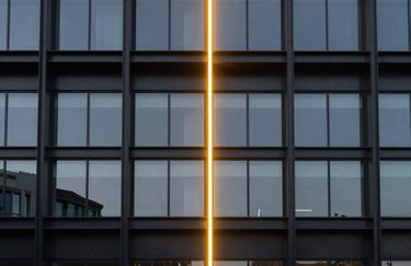 Photography of a modern architectural structure made of black steel and glass, illuminated by a single vertical neon yellow light beam. Symmetrical composition, minimalist tech vibe.