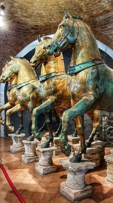 Gilded bronze statues of the Horses of Saint Mark in Venice, showcasing ancient Roman artistry.