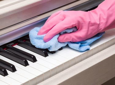 cleaning piano keyboard with microfibre towel