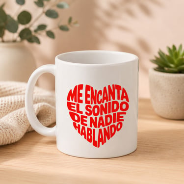 White ceramic mug with 'ME ENCANTA EL SONIDO DE NADIE HABLANDO' (I LOVE THE SOUND OF NO ONE TALKING) in a red heart design
