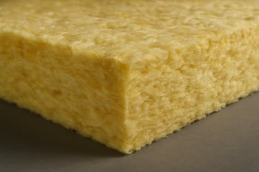 Close-up of high-quality glasswool thermal insulation material, showing detailed texture and density. Clean studio lighting, professional focus on product quality.