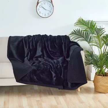 Soft plush throw blanket on sofa, cozy home decor inspiration.