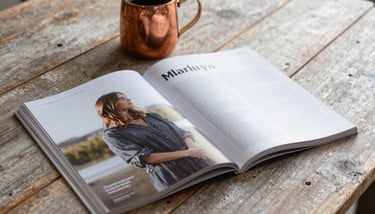 An architectural photograph of a historic brick building in Montana, highlighting clean lines and sophisticated slate-grey window frames.