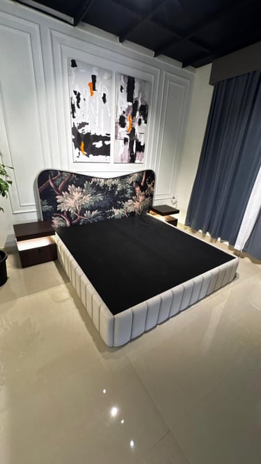 Modern luxury bed with floral tapestry headboard and integrated floating nightstands in a bedroom.