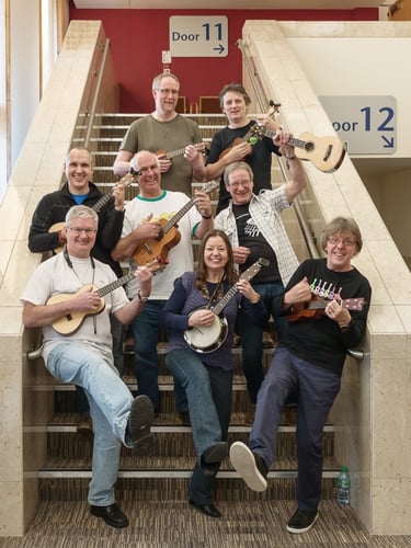 musicians on the stairs with ukuleles