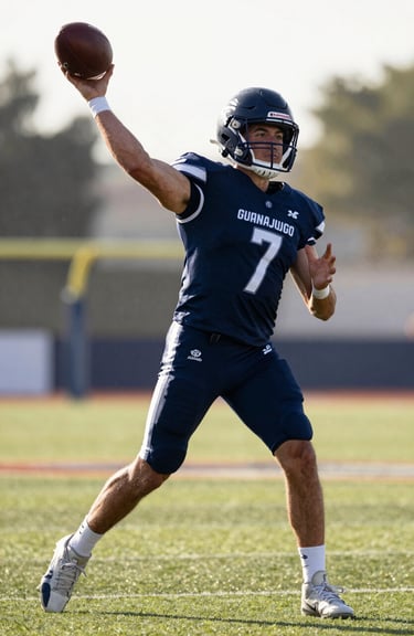 Action shot of a quarterback throwing a football on a bright morning in Guanajuato, wearing deep navy athletic gear, North American style turf field.