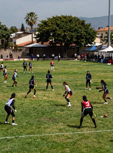 A wide shot of a flag football tournament in Leon, Guanajuato, with multiple fields and spectators, vibrant and community-focused atmosphere.