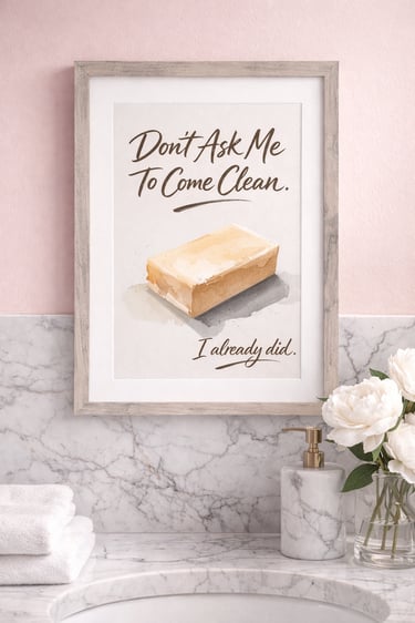 Funny bathroom wall art featuring a bar of soap illustration and witty text in a light wood frame.