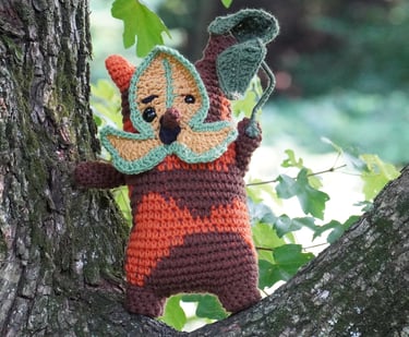 A korok holding a leaf standing in a tree