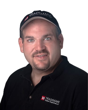 Man in company "Trademark Inspections" work shirt and cap on a white background. # Business Photo, # Headshot, # Corporate ph