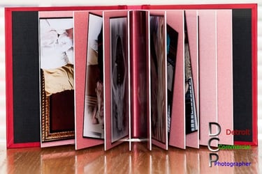 An authors open book showing the pages and a hint of images. #Commercial Product Photography, #Detroit Product Photography,