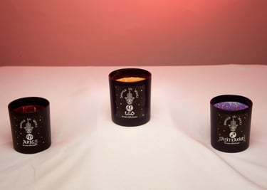 Divinely Lit Wicks Zodiac candle collection with Reddish/Orange background. #Professional Product Photography