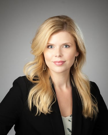 Head shot of beautiful blond woman with a light grey background for business cards.