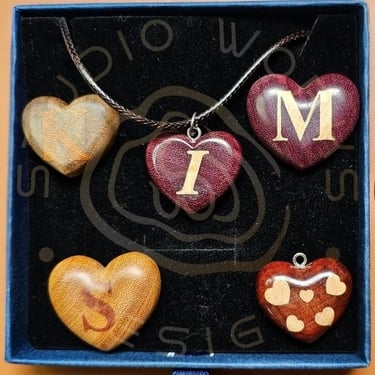 Custom inlay letters in heart-shaped exotic woods
