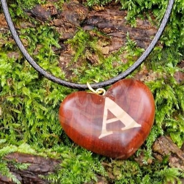 Custom inlay letters in heart-shaped exotic woods