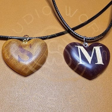 Custom inlay letters in heart-shaped exotic woods