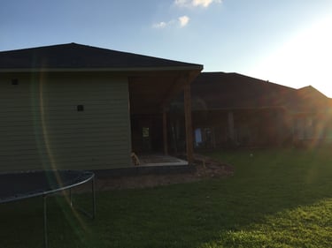 Father's suite and pool house addition. Yard view.