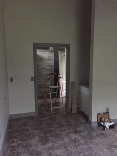 Father's suite and pool house addition.  Interior view from bedroom to bath.