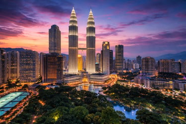 This image shows a breathtaking Kuala Lumpur skyline at sunset with the glowing Petronas Twin Towers