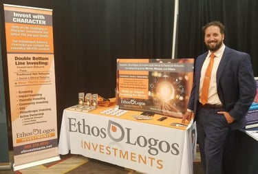 photo of financial advisor in front of display table with branded materials, brochures, table top display, pop-up banner