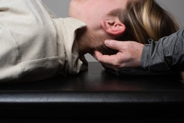 Osteopath releasing suboccipital tension and upper cervical restriction to treat tension headaches in Mississauga